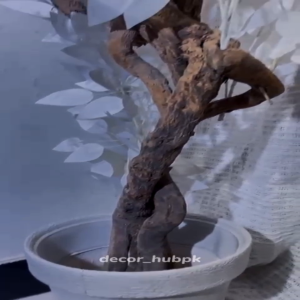 Elegant artificial flower tree with a stylish white pot and realistic design. Perfect for home, office, bedroom, and living room decoration. Modern, maintenance-free indoor decor item.